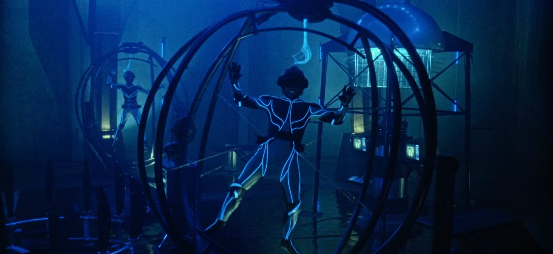 Humans enter the virtual reality age of the '90s, in full body suits and harnessed into gyroscopic spheres.