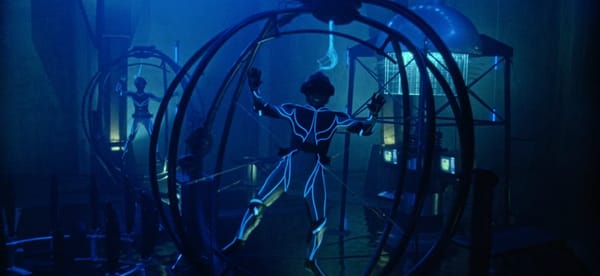 Humans enter the virtual reality age of the '90s, in full body suits and harnessed into gyroscopic spheres.