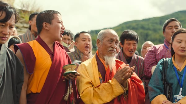 Buddhist monks lead their village in prayer in "The Monk and the Gun"